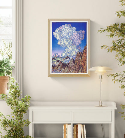Les Dents Du Midi by Clément Vuillier, vertical risograph art print showing jagged alpine mountains beneath enormous cream and pink clouds against a deep blue sky, bold wall art for modern interiors.