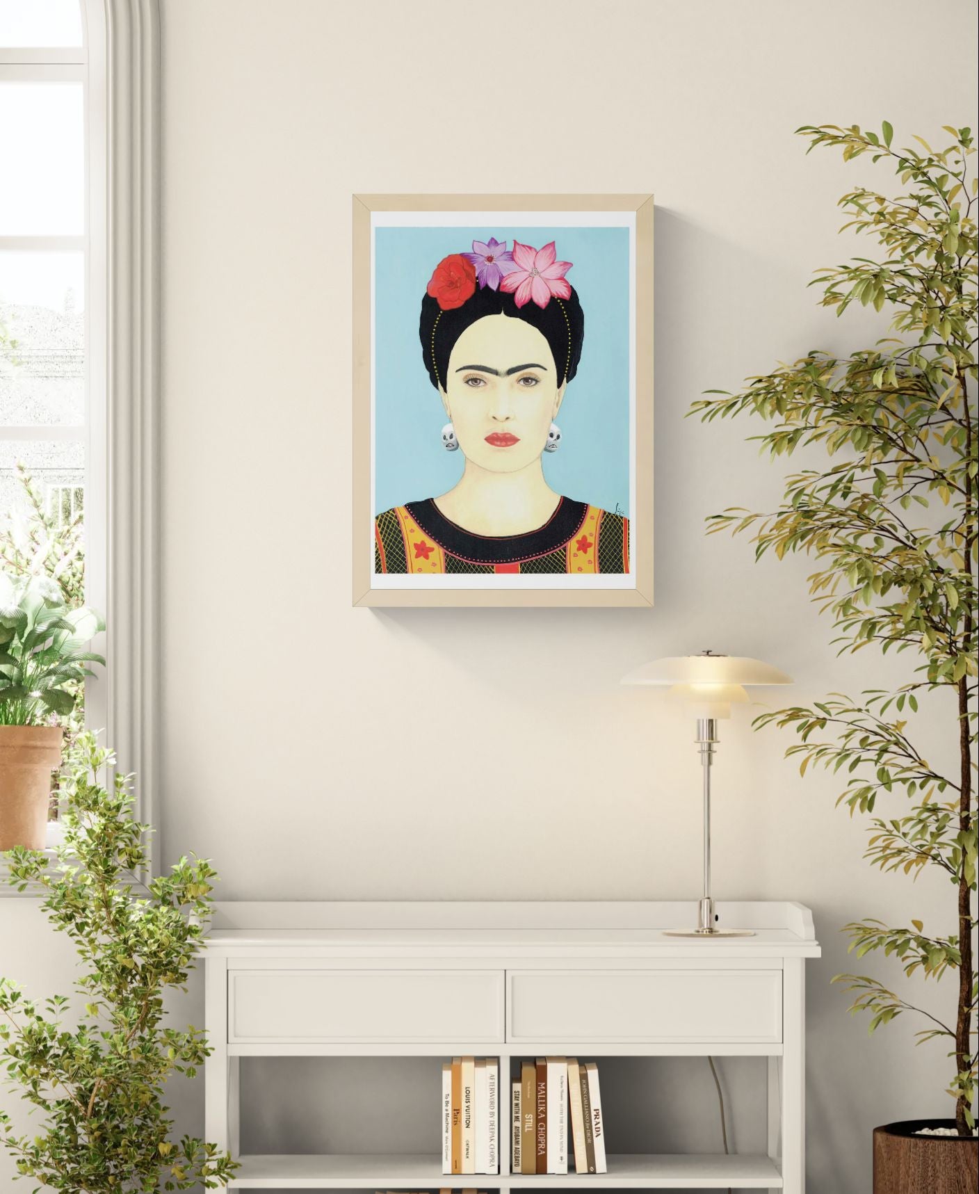 Colourful portrait art print of Frida Kahlo by Soizic Bihel featuring flowers in her hair, skull earrings, and a light blue background, contemporary pop culture wall art print for modern interiors.