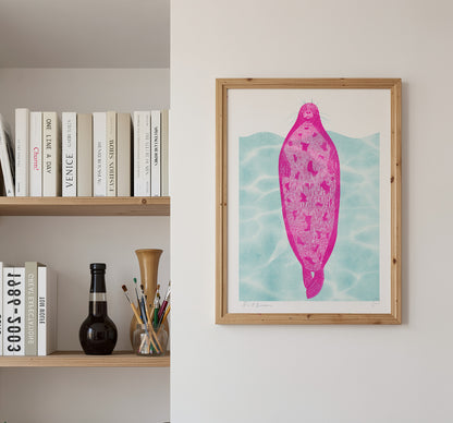 Pink seal floating against turquoise water in a playful contemporary risograph style, printed in portrait A3 format. Colourful humorous wall art for kitchens, offices and modern interiors.