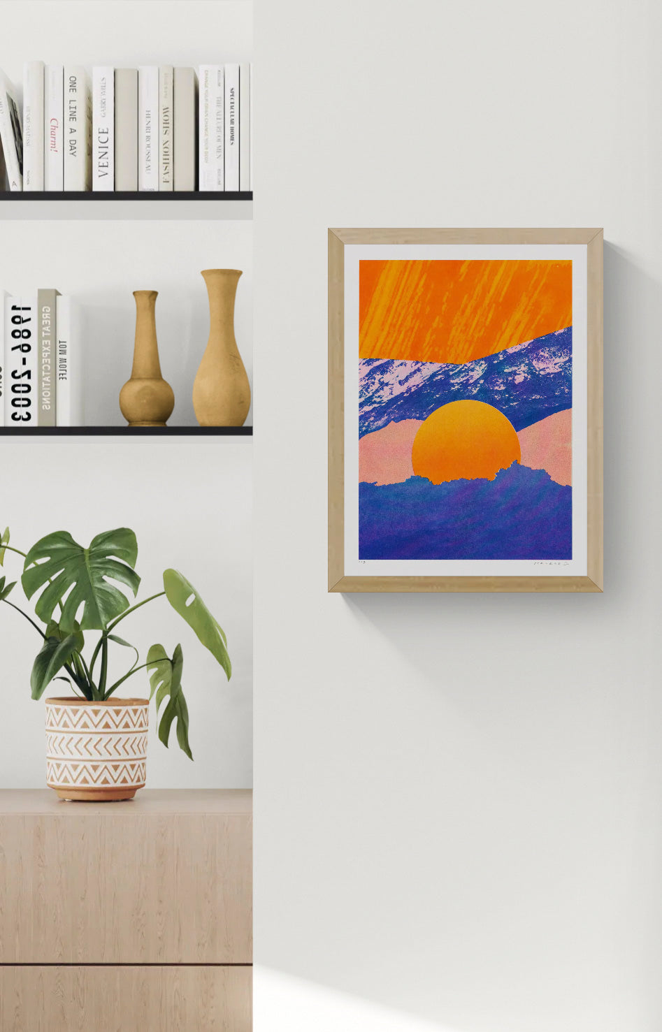 Fragments 5.0 by PTRVRKD, vertical A3 risograph print of a graphic mountain landscape with a large orange sun, deep blue peaks and soft pink tones, ideal as colourful contemporary wall art.