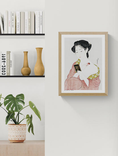 Japanese woman applying face powder in a red patterned kimono by Goyō Hashiguchi, vertical Japanese digital art print in soft red, green, black and cream tones for elegant wall decor.