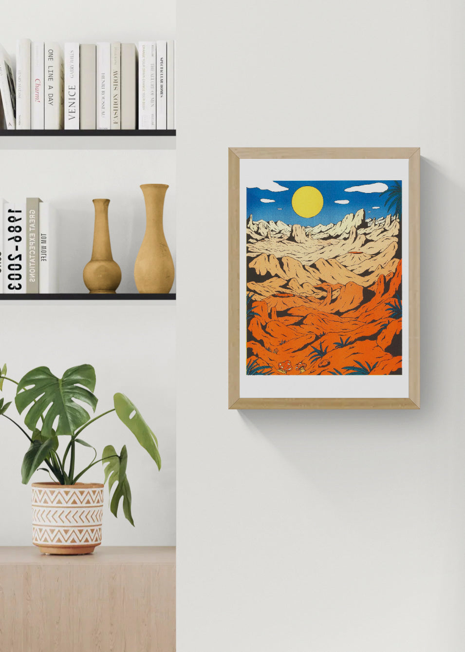 Landscape risograph art print by Floor van het Nederend showing an orange rocky desert beneath a yellow sun and deep blue sky, in a bold retro graphic style and vertical format for colourful wall decor.