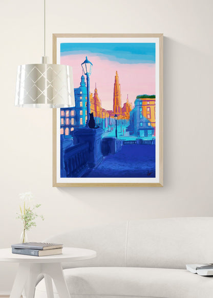 Vertical giclée art print by Valeria Maggiani showing a colourful view towards Antwerp Cathedral, with a seated black cat, deep blue streets and a pink sky, ideal for contemporary wall decor.