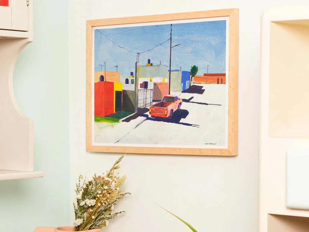 Risograph art print of San Luis Potosi, Mexico City by Japanese artist Nao Tatsumi. A colorful urban street scene featuring pastel buildings and a red pickup truck under bright sunlight, capturing the beauty of everyday Mexican architecture in a minimalist, painterly style.