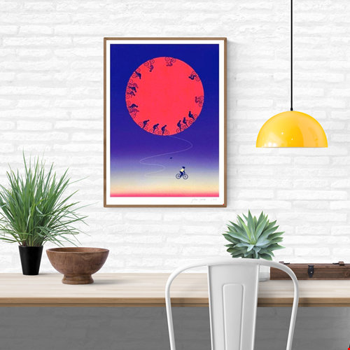 Limited edition A3 risograph print titled The Free Rider by Julie Pernet, featuring cyclists circling a bold red sun on a deep blue gradient background, printed in four colours on Munken Print White 150 g/m² paper, signed and numbered contemporary illustration made in Belgium.