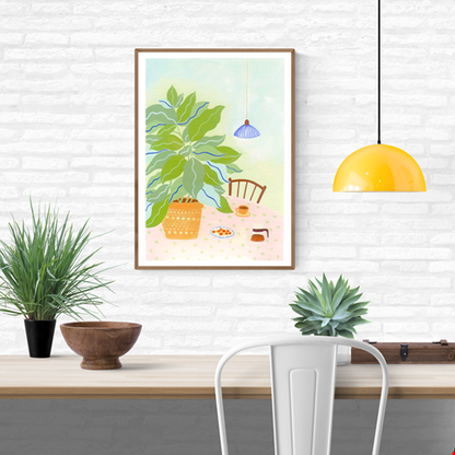 A3 illustration "Coffee Plant" by Leens showing a large leafy plant in a yellow pot, a table with a pink floral cloth, coffee cup, cookies, and carafe. Ideal for cozy kitchen or slow living decor.
