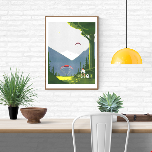 Risograph print Game Boy by Tom Haugomat — a boy playing his Game Boy in a sunny mountain valley while paragliders float in the sky, surrounded by pine trees and soft light. Minimalist French illustration blending nature, nostalgia, and modern design.