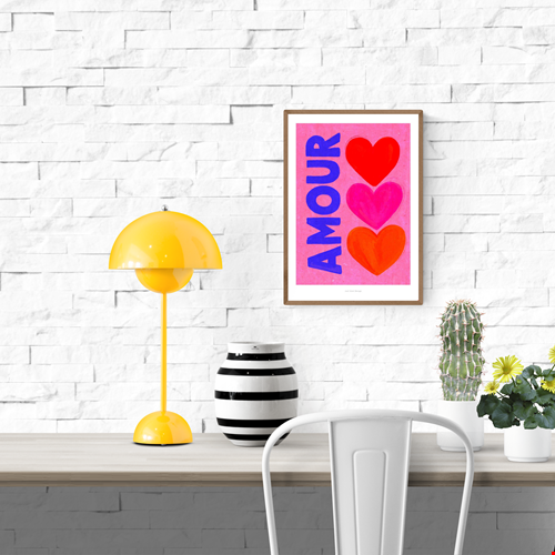 Bright pop art print with the word “AMOUR” in bold blue letters beside three colorful hearts (red, pink, and orange) on a pink background — Amour by Just Cool Design, vibrant Giclée art print for modern interiors and love-themed wall decor.