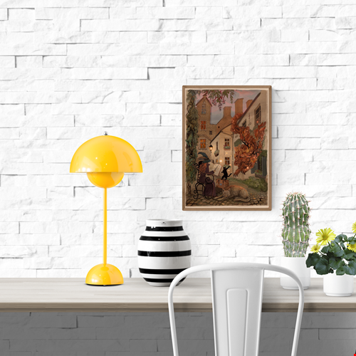 Enchanting giclée art print by Lena Yampolski featuring a whimsical witch reading a spellbook in a charming Antwerp courtyard with a black cat, a glowing leaf creature, and warm streetlight tones. Perfect wall art for lovers of fantasy, witches, and European magic scenes.