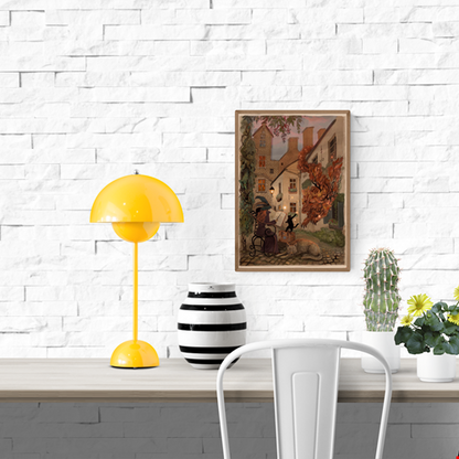 Enchanting giclée art print by Lena Yampolski featuring a whimsical witch reading a spellbook in a charming Antwerp courtyard with a black cat, a glowing leaf creature, and warm streetlight tones. Perfect wall art for lovers of fantasy, witches, and European magic scenes.