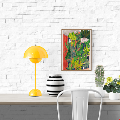 Bloom by Kim Timmermans – botanical illustration of lush green plants surrounding a terracotta building with small white figures at windows, whimsical and vibrant wall art available at Galerie Frits