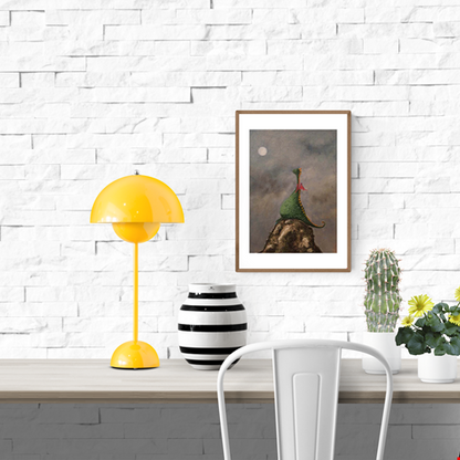 Whimsical illustration by Willy Leung featuring a green dragon with red wings sitting peacefully on a rocky cliff under a cloudy night sky with a glowing full moon.