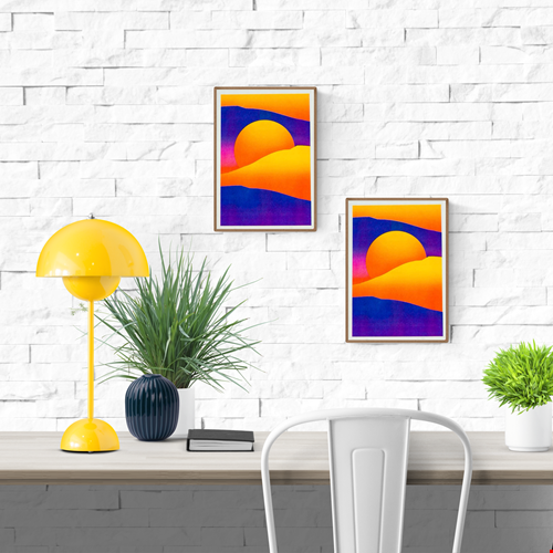 Striking 12.5 x 17.5 cm risograph print of a surreal desert landscape with glowing orange sand dunes, deep purple shadows, and a radiant yellow sun setting behind rolling hills. Modern minimalist wall art with bold colour contrast, designed by Dutch illustrator PTRVRKD and handprinted in the Netherlands using eco-friendly soy inks.