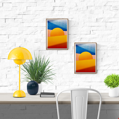 Minimalist desert art print with bold yellow sun and African dune landscape in vivid blue, orange, and peach tones by Dutch artist PTRVRKD – A3 risograph print, limited edition, eco-friendly ink.