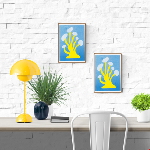 Funky yellow mushroom risograph print by Dutch illustrator PTRVRKD – playful minimalist design with bold organic mushroom shape on a bright blue background, printed with eco-friendly soy inks on 250 gsm Biotop paper, handmade in the Netherlands – quirky small art print for modern interiors.