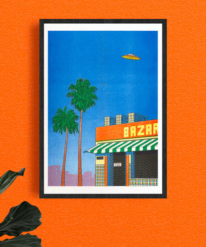Colorful risograph art print titled Spain at 15h by Simon Bailly, featuring two tall palm trees, a vivid orange "BAZAR" storefront with green-and-white striped awning, tiled walls, and a flying saucer hovering in a bright blue sky; evokes a mix of Spanish urban scenery and retro science fiction, ideal for fans of playful and surreal illustrated posters.
