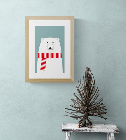Minimalist illustration by Studio Frits of a charming polar bear wearing a bold red and white striped scarf against a soft blue background. Clean lines and Scandinavian-inspired design make this print a playful yet stylish addition to modern nurseries, seasonal decor, or minimalist art collections
