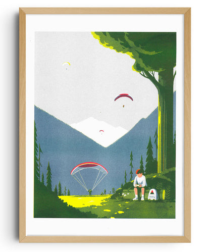 Risograph print Game Boy by Tom Haugomat — a boy playing his Game Boy in a sunny mountain valley while paragliders float in the sky, surrounded by pine trees and soft light. Minimalist French illustration blending nature, nostalgia, and modern design.