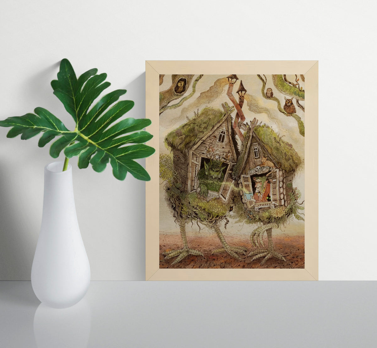 Whimsical folklore-inspired giclée art print featuring two walking woodland cottages on bird-like legs, magical creatures, owls, witches, and detailed forest elements in earthy tones. Vertical fantasy wall art for cozy home decor.