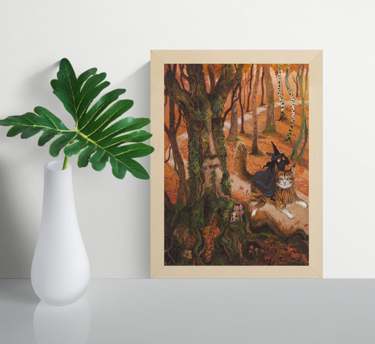 Whimsical autumn forest illustration featuring a witch riding a giant cat beside an ancient tree spirit with a human face, detailed fantasy artwork in warm orange, green, and brown tones, vertical giclée wall art for cosy home decor.