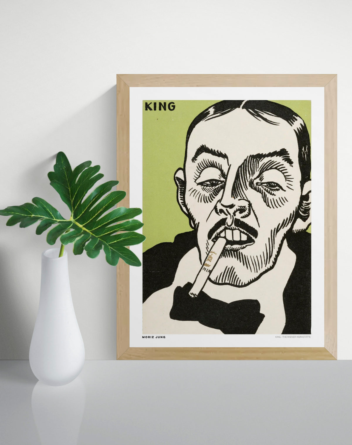 King by Moriz Jung, vertical digital art print featuring an expressive male portrait with cigarette, bold black linework and green background, ideal as graphic wall art.