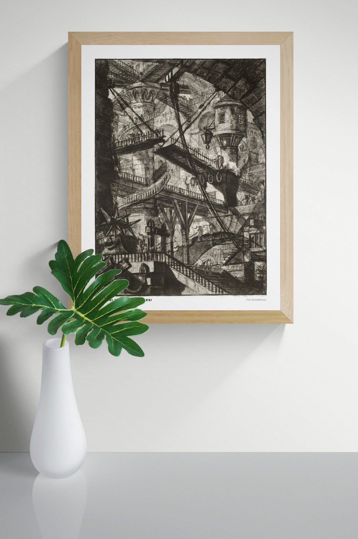 The Drawbridge by Giovanni Battista Piranesi, black and white architectural etching showing overlapping bridges, staircases and vaulted stone structures. Vertical digital art print for classic or industrial wall decor.