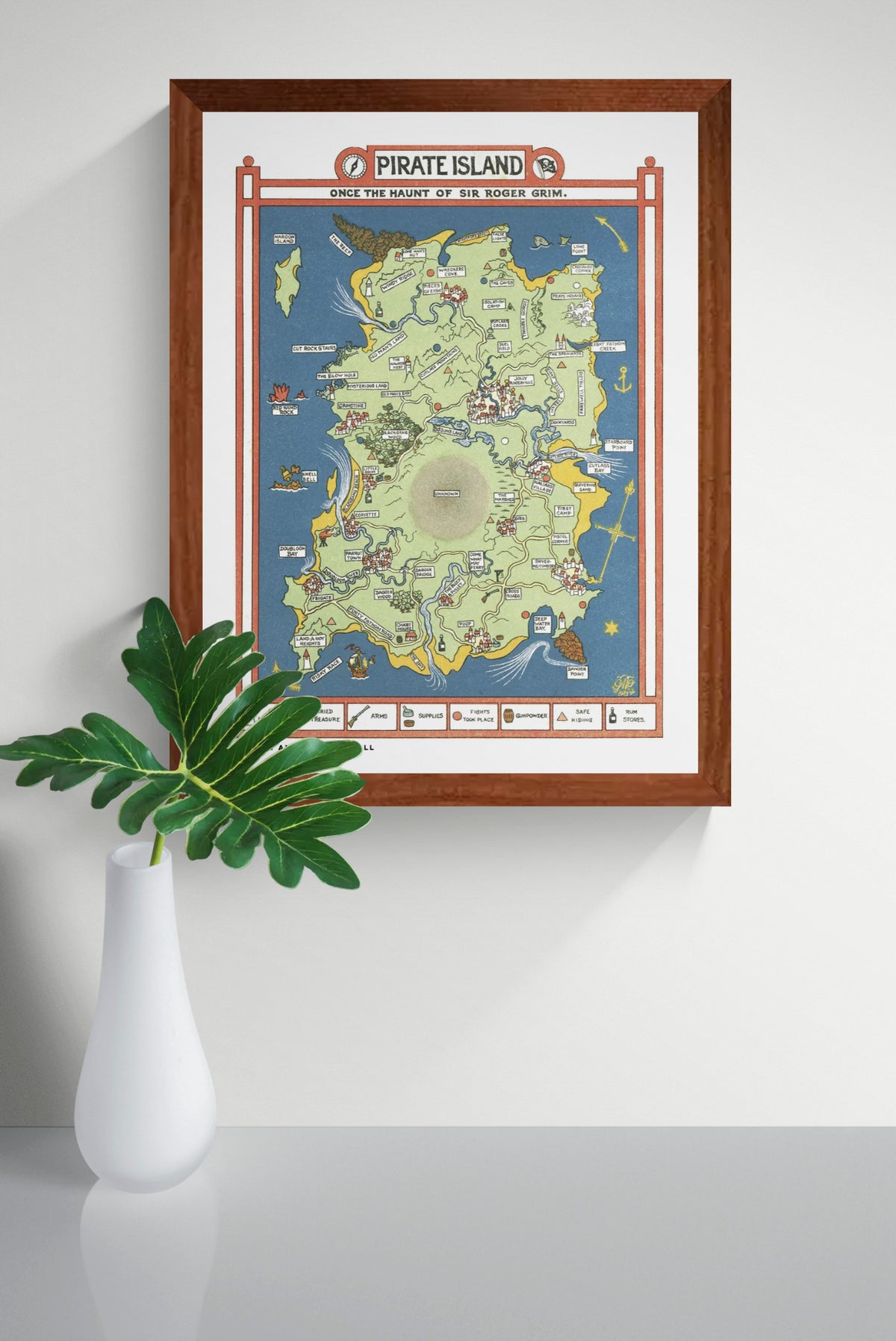 Vintage illustrated Pirate Island map by Gilbert Anthony Pownall, featuring a green island surrounded by blue sea, red borders, hidden treasures, pirate ships and playful landmarks. Vertical digital art print for nostalgic wall decor.