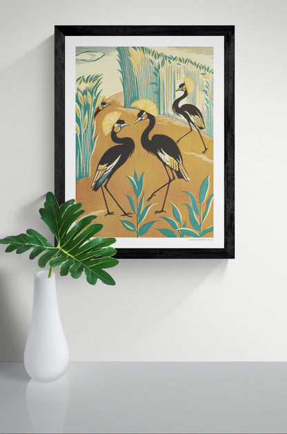 Vintage-style vertical illustration of four black crowned cranes with golden feather crests among teal reeds and warm orange earth. A Jungle Picknick by Clifford Webb, reproduced as a digital wall art print.