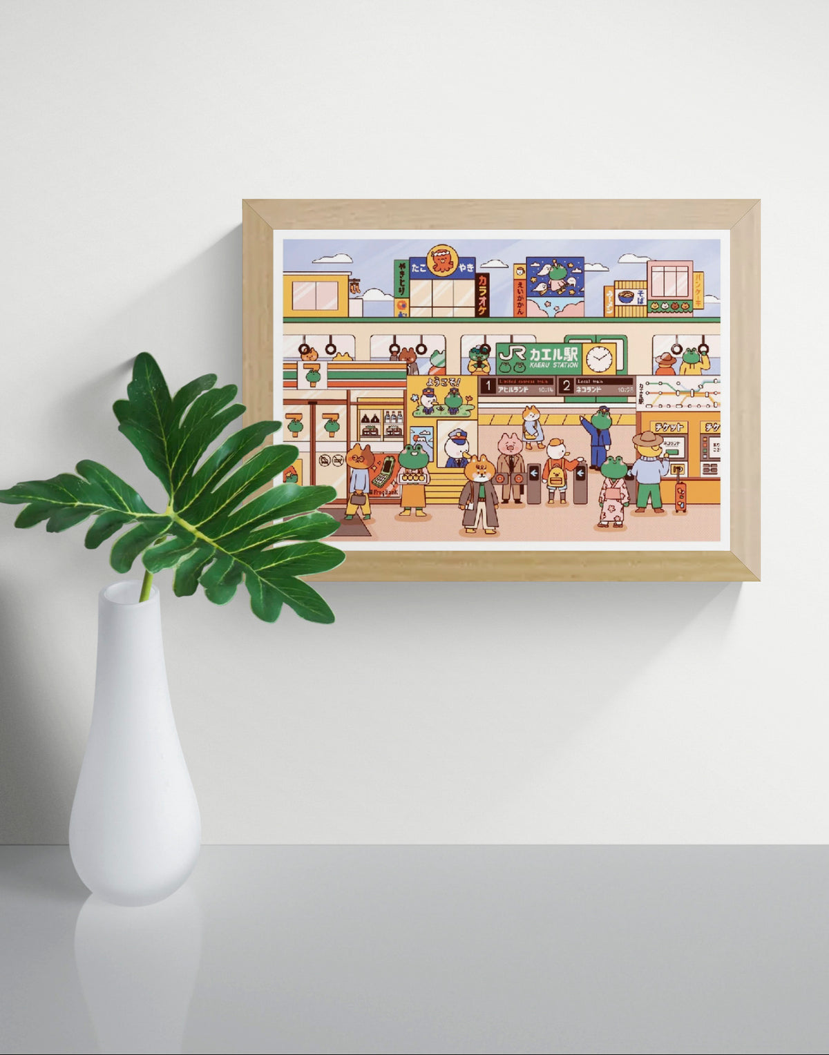 Colorful kawaii illustration of Kaeru Station, a Japanese train station filled with cute frogs, animal commuters and playful shops. Pastel orange, green and blue digital art print in A4 landscape format.