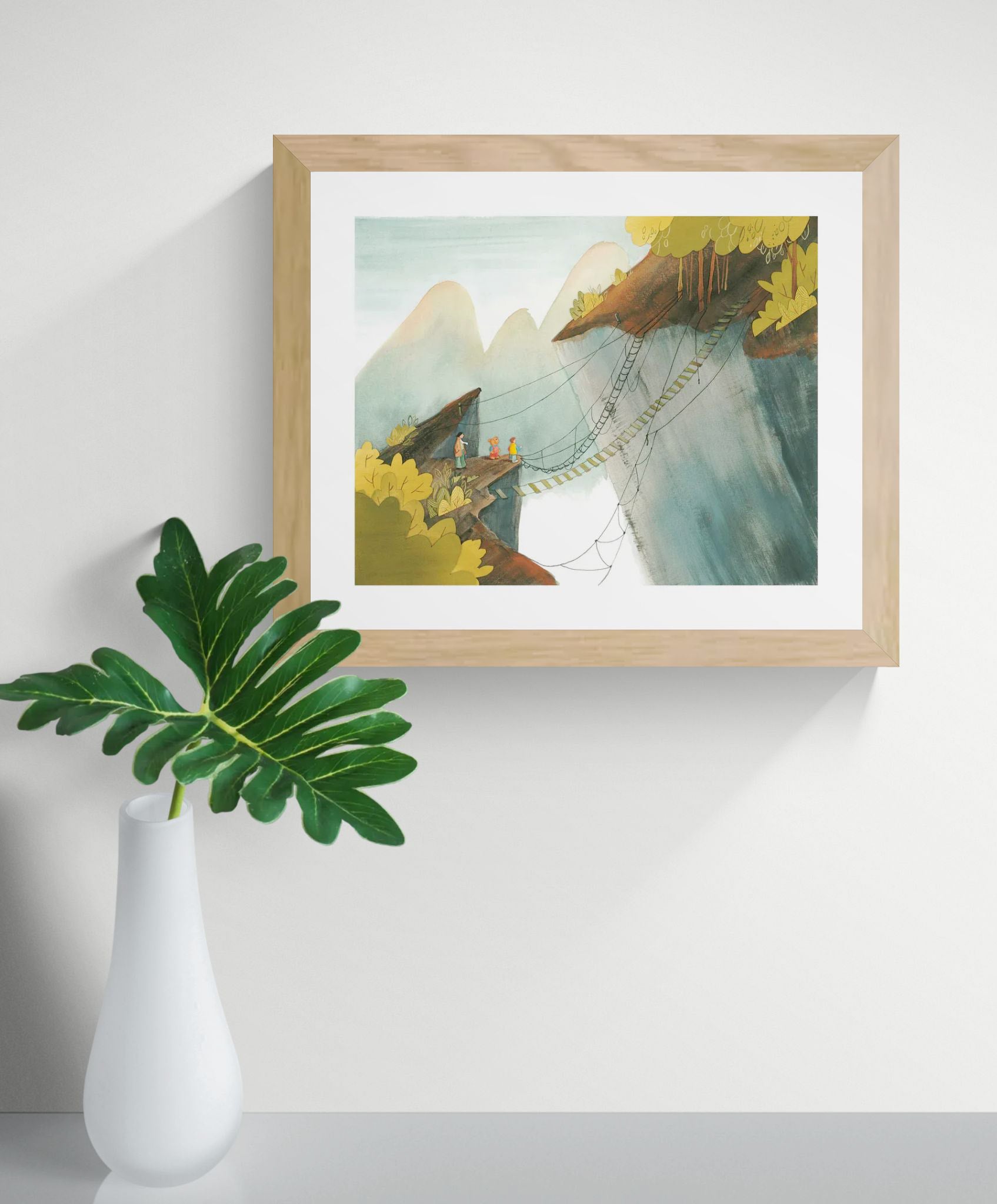 De Kloof by Rosalien Helsen featuring travelers crossing a fragile rope bridge between cliffs, created with acrylic painting and digital collage in soft green, blue, and ochre tones. Landscape-format fine art print for calm, contemporary interiors.