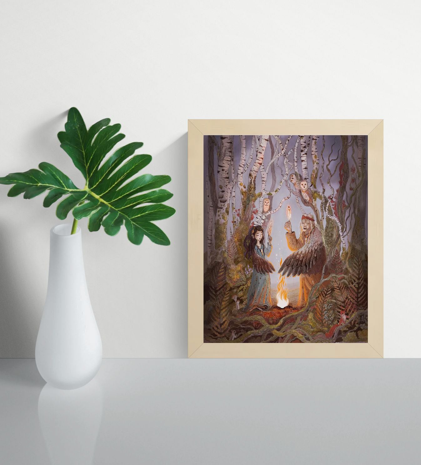 Detailed fantasy giclée art print featuring two winged women performing a ritual beside a glowing fire in a mystical birch forest, surrounded by owls, woodland animals, and folklore-inspired details in soft earthy colors. Vertical wall art for cozy home decor.
