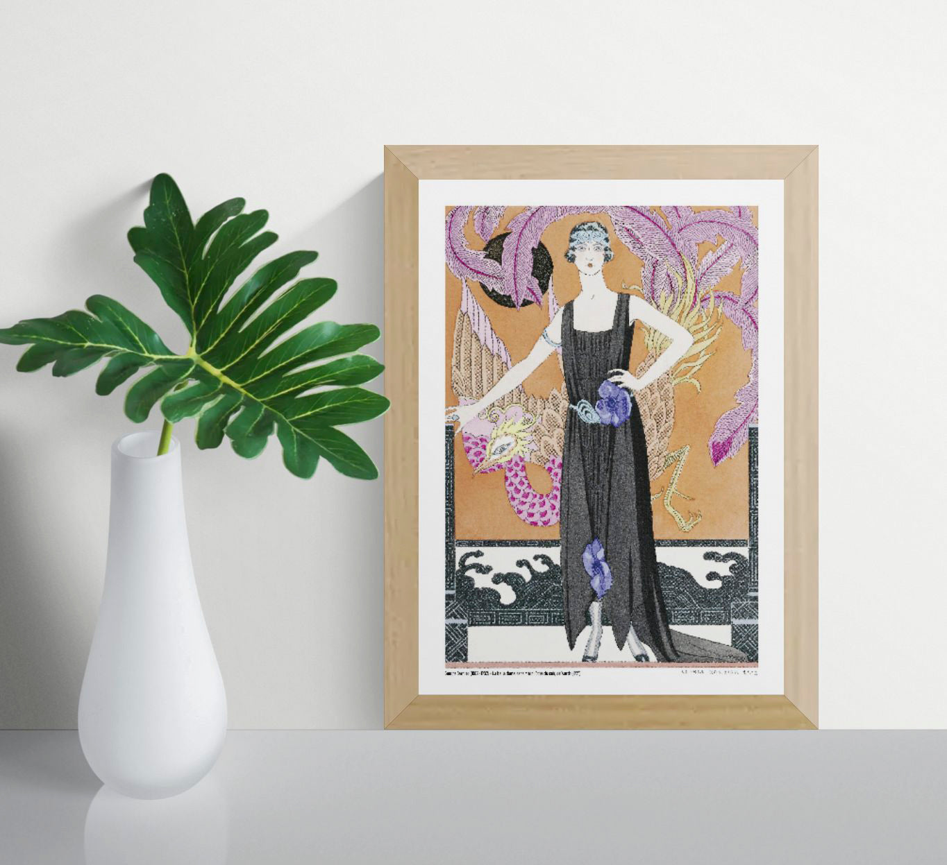 La Belle Dame sans Merci by George Barbier, a vertical Art Deco fashion illustration of a woman in a black evening dress surrounded by a colourful bird, purple feathers and warm orange tones, ideal as elegant wall decor.