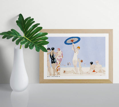 Horizontal Art Deco beach illustration by George Barbier showing stylish swimmers in black, pink, red, and cream against a pale blue sea, printed as decorative A4 wall art.