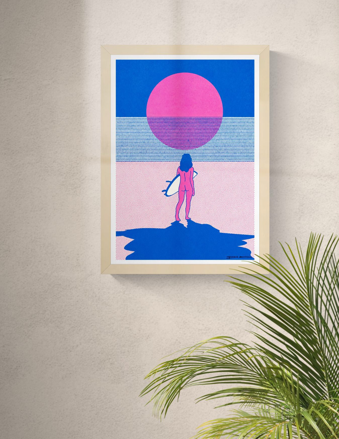 Minimalist risograph print of a surfer standing on the beach facing a bright pink sun over the sea, in bold blue and pink tones. Contemporary landscape wall art for modern coastal interiors.