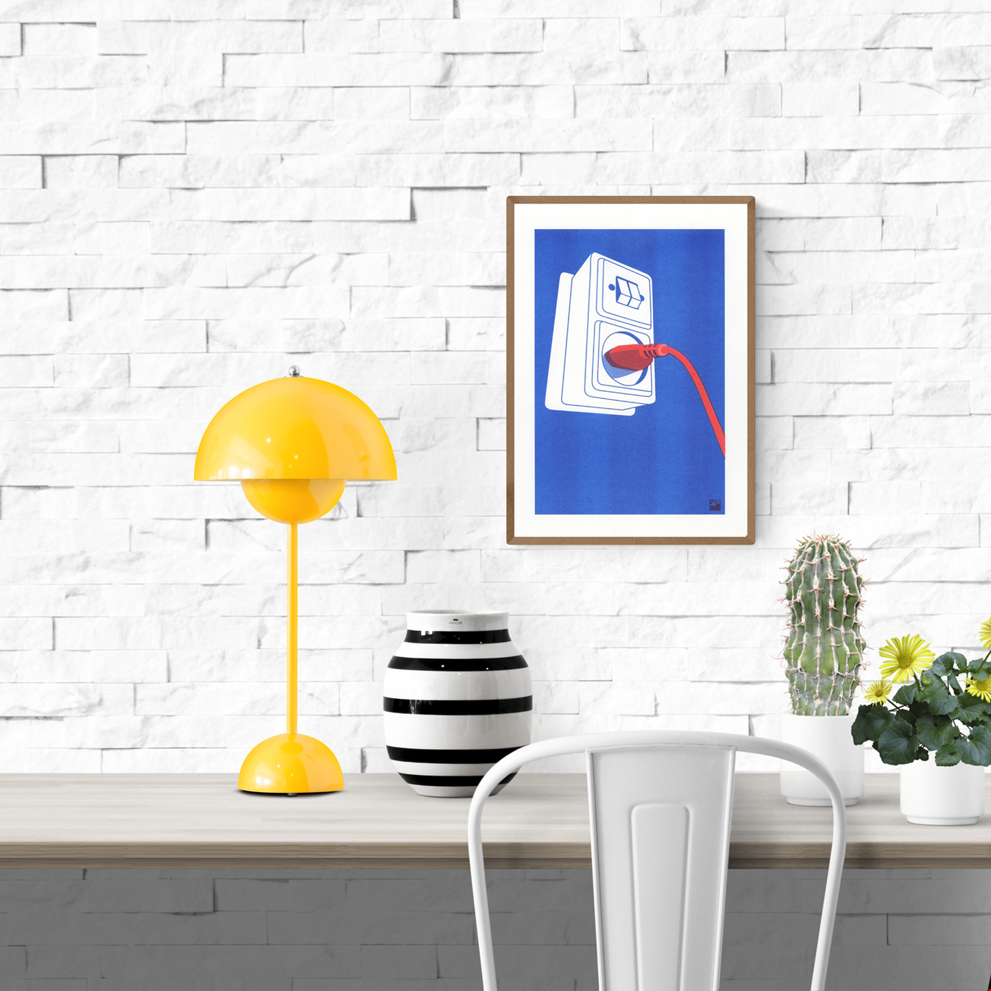 Risograph art print titled Socket by VrijFormaat — minimalist red and blue illustration of an electric wall plug and cord, printed on Biotop 160g A4 paper. Contemporary Dutch design artwork celebrating everyday objects, perfect for modern interiors and design lovers.
