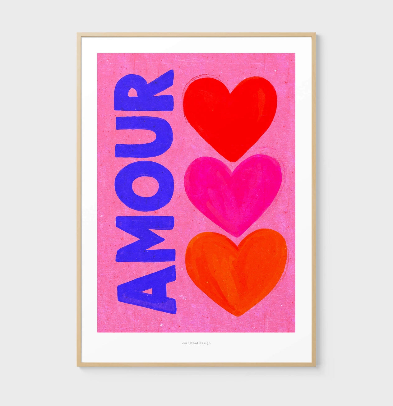 Bright pop art print with the word “AMOUR” in bold blue letters beside three colorful hearts (red, pink, and orange) on a pink background — Amour by Just Cool Design, vibrant Giclée art print for modern interiors and love-themed wall decor.