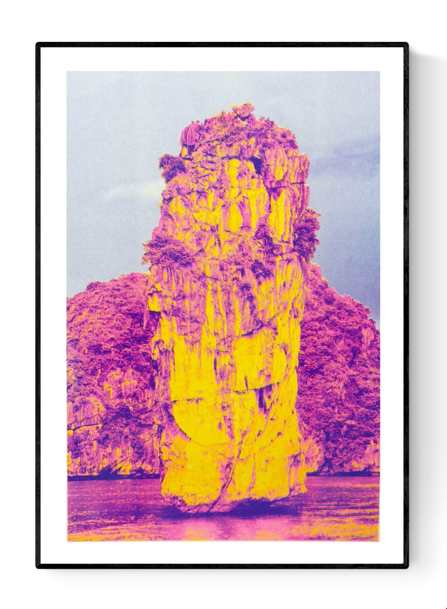 Ha Long Bay risograph art print by PTRVRKD in bold yellow and magenta tones, limited edition A3 poster printed on Munken Pure Rough paper, modern vibrant landscape artwork for home decor, contemporary risograph print made in the Netherlands.