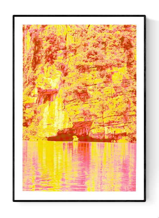 Vibrant risograph art print inspired by the cliffs and waterways of Ninh Binh, Vietnam, featuring bold neon yellows and pinks, textured rock formations, and reflective water. Contemporary limited-edition A3 artwork by PTRVRKD printed on Munken Pure Rough paper, perfect for modern interior decor.