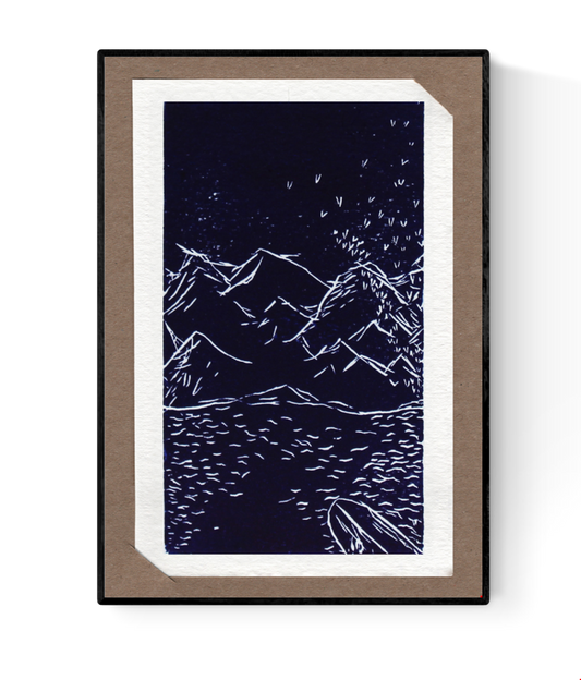 Hand-printed linocut art card by Belgian artist Ilia Claus featuring a mountainous landscape reflected in water, with falling leaves or stars. From the Bergen series. Includes passe-partout and envelope.