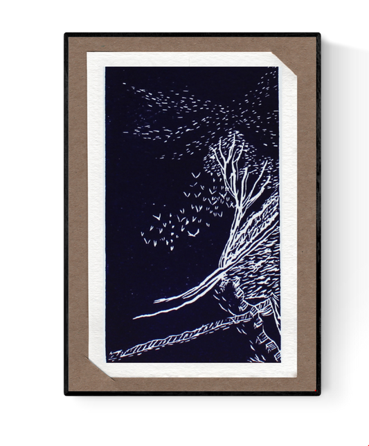 Linocut illustration of a solitary tree on a hillside, surrounded by flying birds under a night sky. Handmade art card by Belgian illustrator Ilia Claus. Includes passe-partout and envelope.