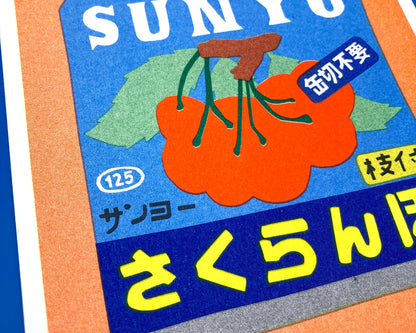 Colorful risograph art print of a Japanese can of cherries titled Canned Cherries by We Are Out Of Office, featuring bold retro typography and six-color rice-ink printing on Biotop 300g paper. Perfect wall art for pop art and Japanese design lovers.