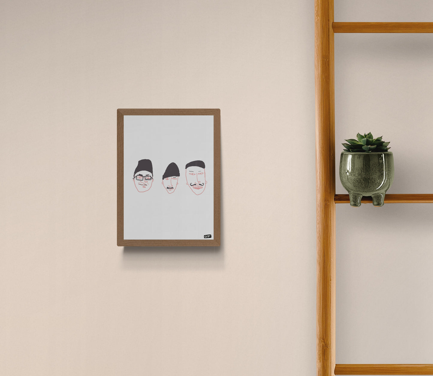Minimalist digital art print featuring three abstract illustrated faces with hats and moustaches by Belgian illustrator Gert Paenen, printed on light grey background in expressive hand-drawn style.