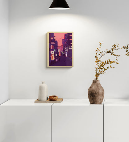 Fine art giclée print titled “Nights in Japan” by Valeria Maggiani featuring a cinematic Japanese city street at dusk with neon signs, warm shop lights, urban silhouettes, and a pink-purple evening sky, printed on 100% cotton textured paper A4 size, ideal for modern home decor and contemporary wall art in Belgium and Europe.