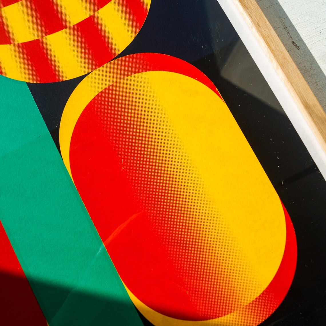 Bold graphic screenprint of a stylized red and yellow flower with geometric shapes on a black background – popping flower by PTRVRKD, 40 x 50 cm limited edition art print made in the Netherlands.