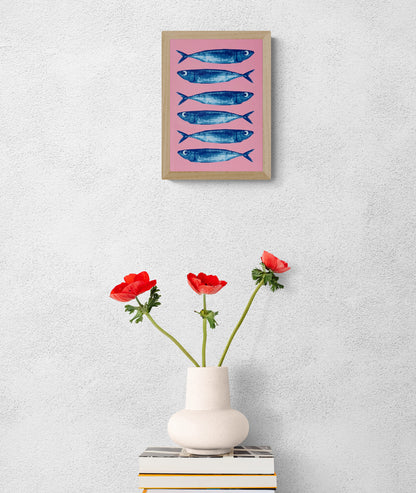 Sardines art print by PTRVRKD, blue fish on pink background, pop art seafood illustration A5, modern graphic wall art.
