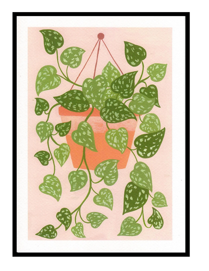 Scindapsus plant art print by Leens with cascading green leaves in a hanging terracotta pot on a blush pink background, modern botanical wall decor for cozy interiors.