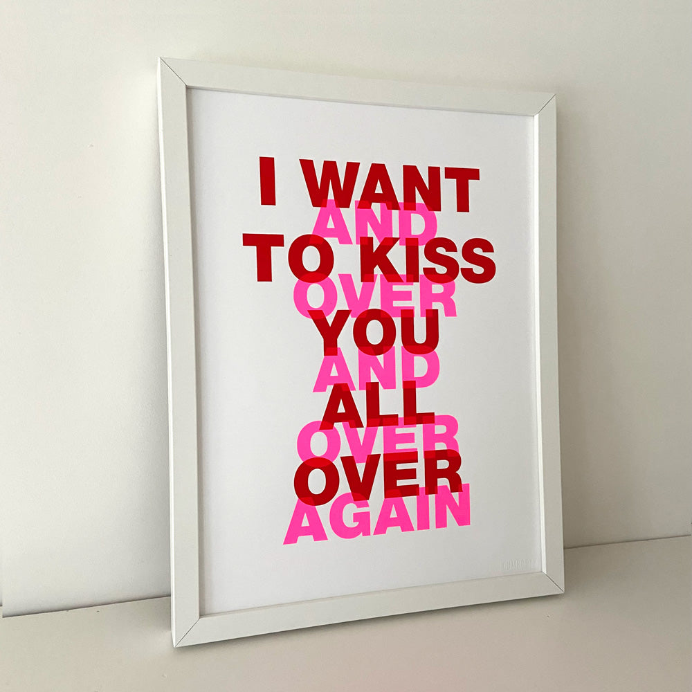Typography art print ‘I Want to Kiss You All Over’ by Gumbootz, 30×40 cm hand-pulled screen print in bold red and fluorescent pink, modern graphic poster with overlapping text design, contemporary wall art for lovers of expressive, romantic prints.